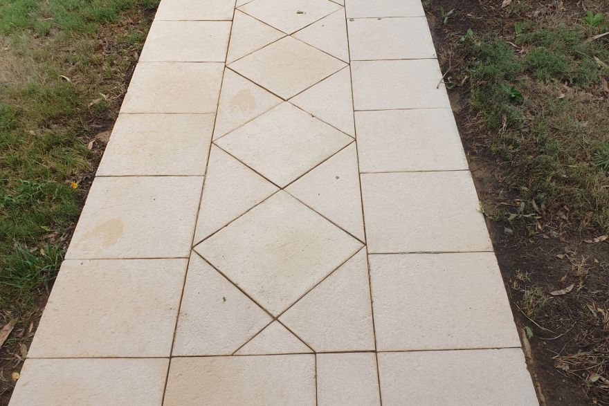 Before and after cleaning on sandstone pavers: after