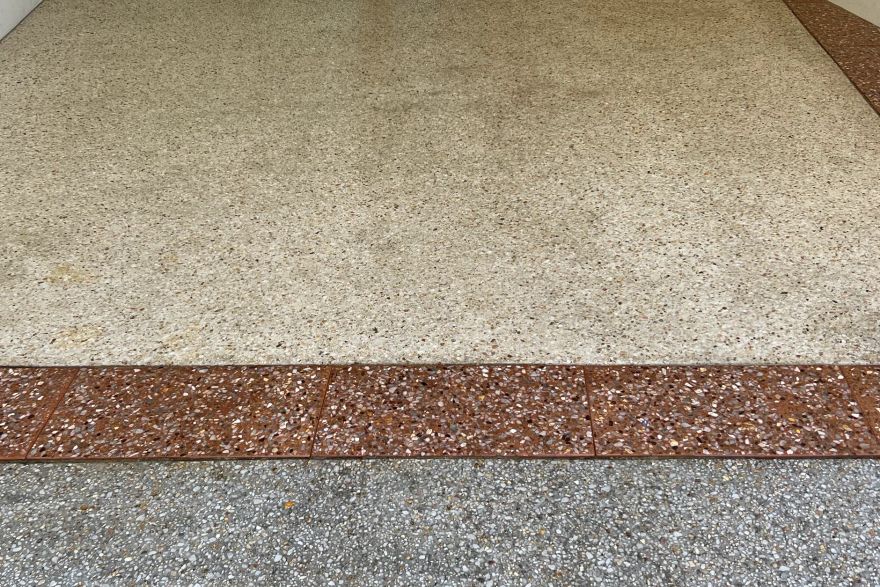 Before and after cleaning on concrete exposed aggregate: after