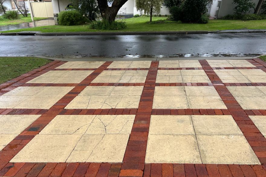 Before and after cleaning on sandstone pavers, brick pavers · Driveway: after