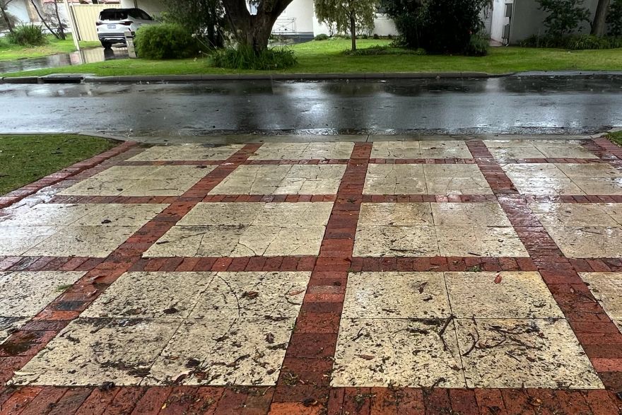 Before and after cleaning on sandstone pavers, brick pavers · Driveway: before