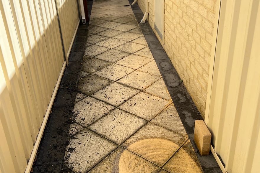 Before and after cleaning on sandstone pavers · Path: before