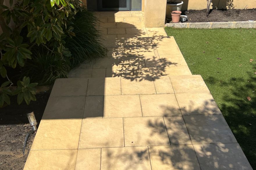 Before and after cleaning on sandstone pavers: after