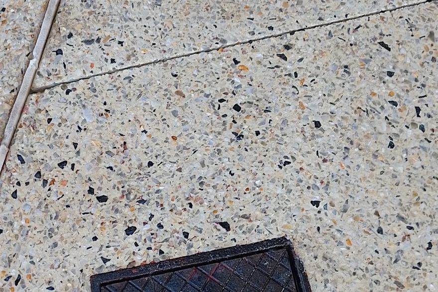 Before and after paint removal on concrete exposed aggregate: after