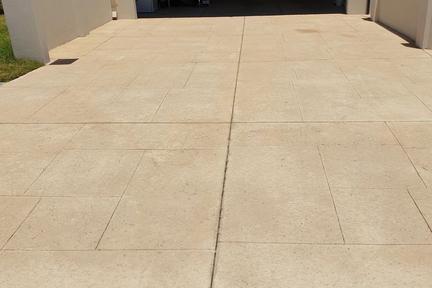 Before and after cleaning on liquid limestone · Driveway: after