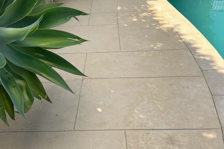 Before and after cleaning on liquid limestone · Poolside: after