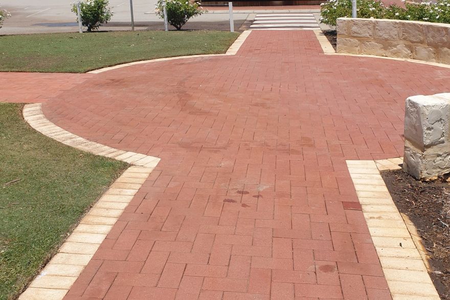 Before and after rust / bore stains on brick pavers: after