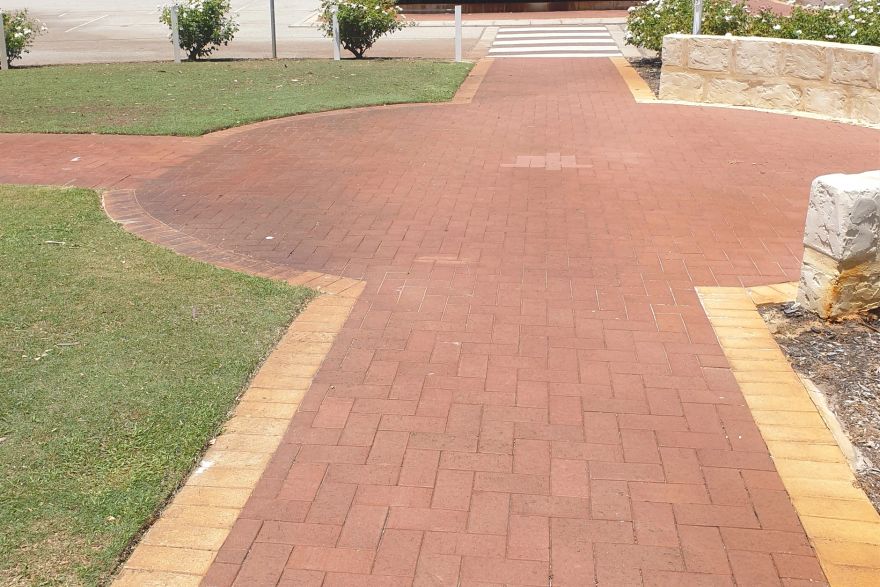 Before and after rust / bore stains on brick pavers: before