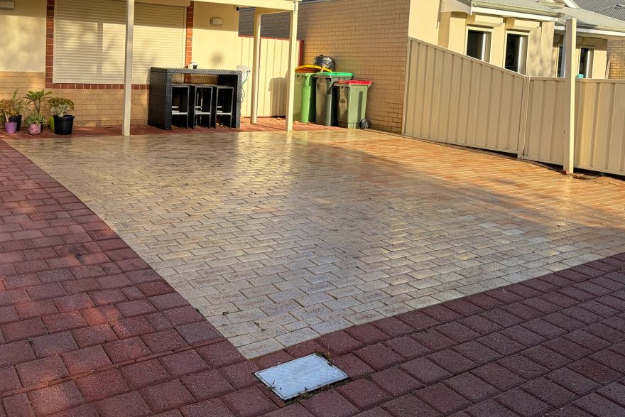 Before and after oil stains on brick pavers · Driveway: after