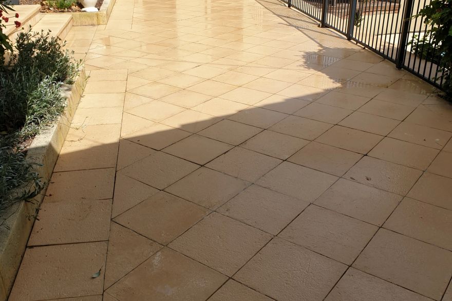 Before and after cleaning on sandstone pavers: after