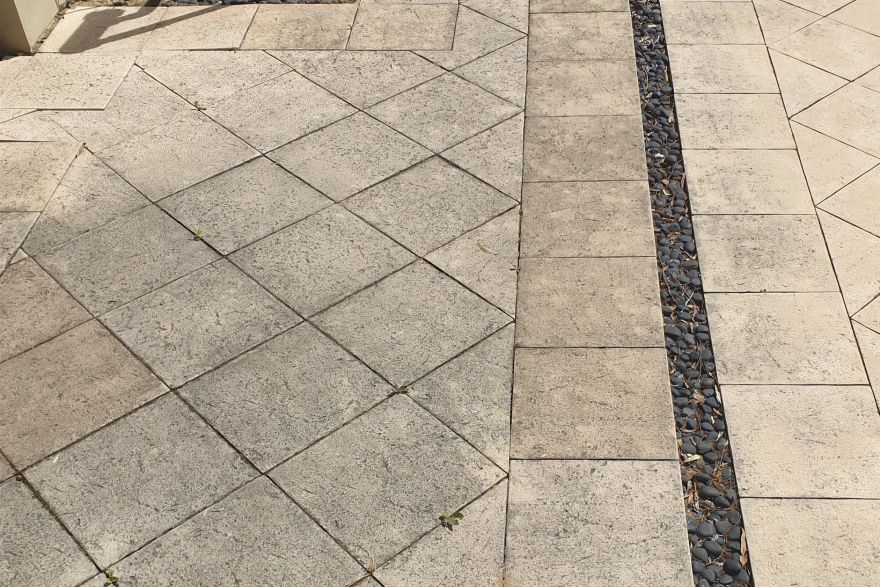 Before and after cleaning on sandstone pavers: before
