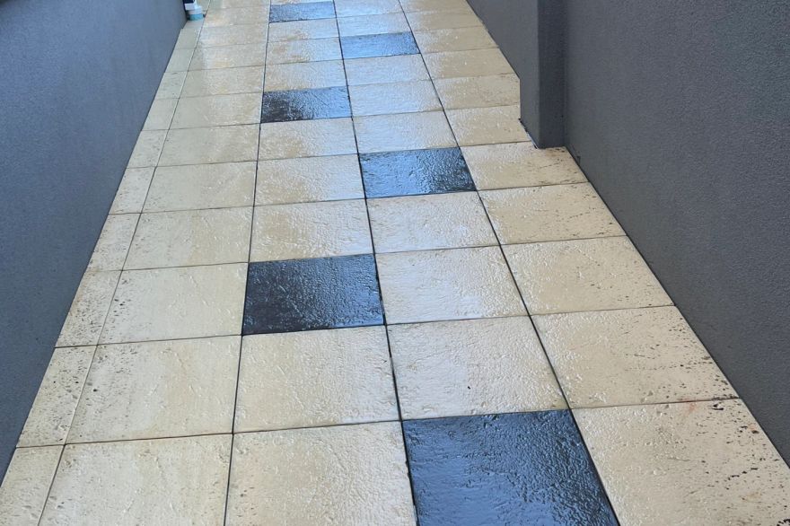 Before and after cleaning on sandstone pavers · Path: after