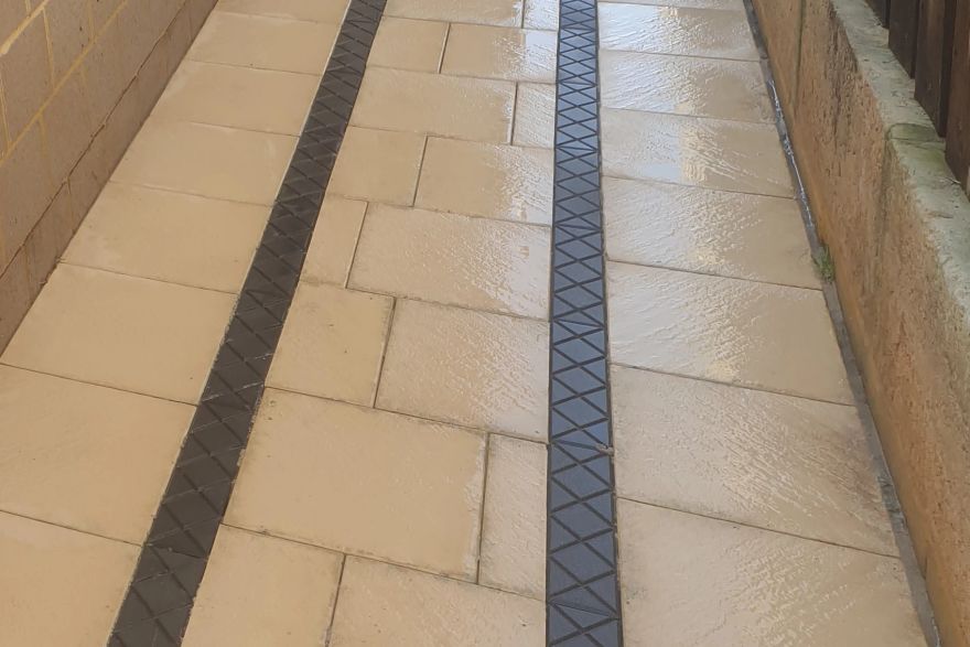Before and after cleaning on sandstone pavers: after