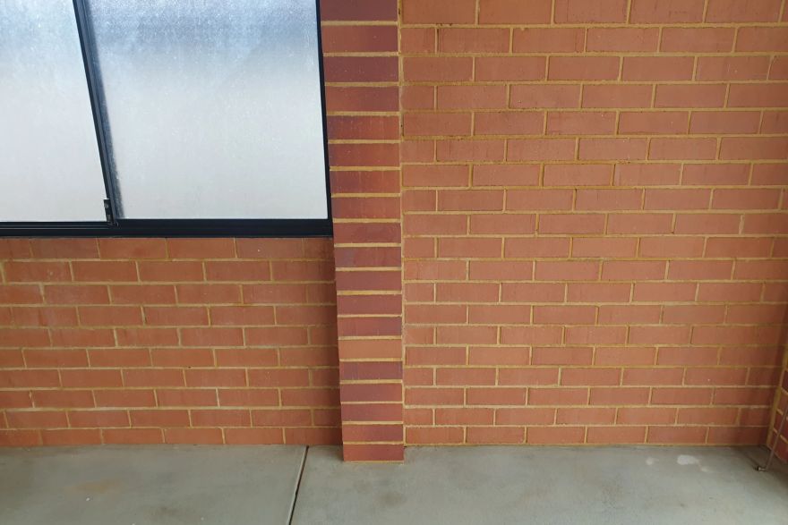 Before and after graffiti on brick pavers: after