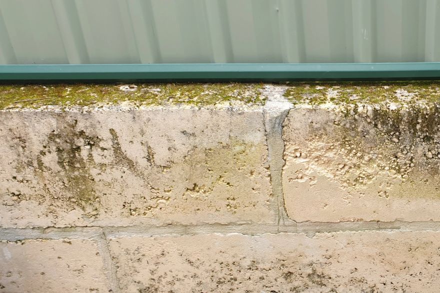 Before and after cleaning on limestone block: before