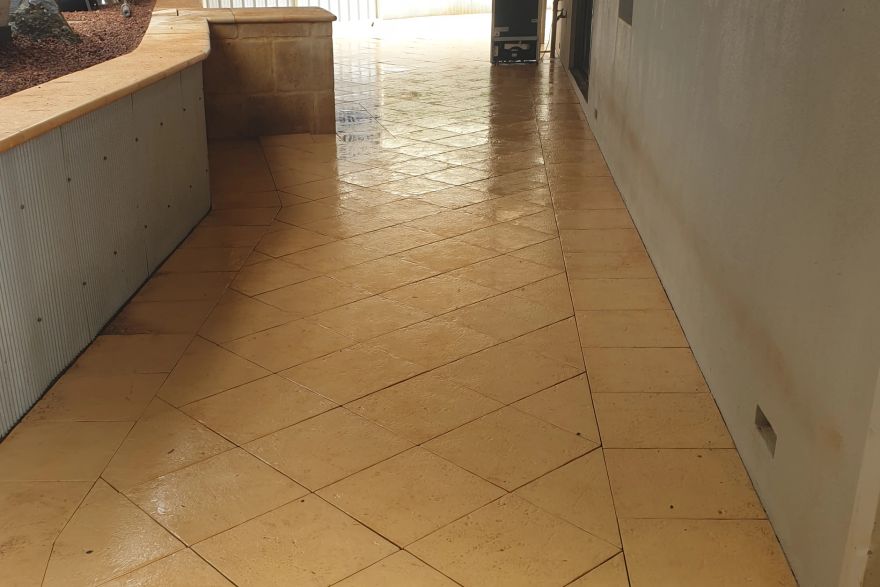 Before and after cleaning on sandstone pavers: after