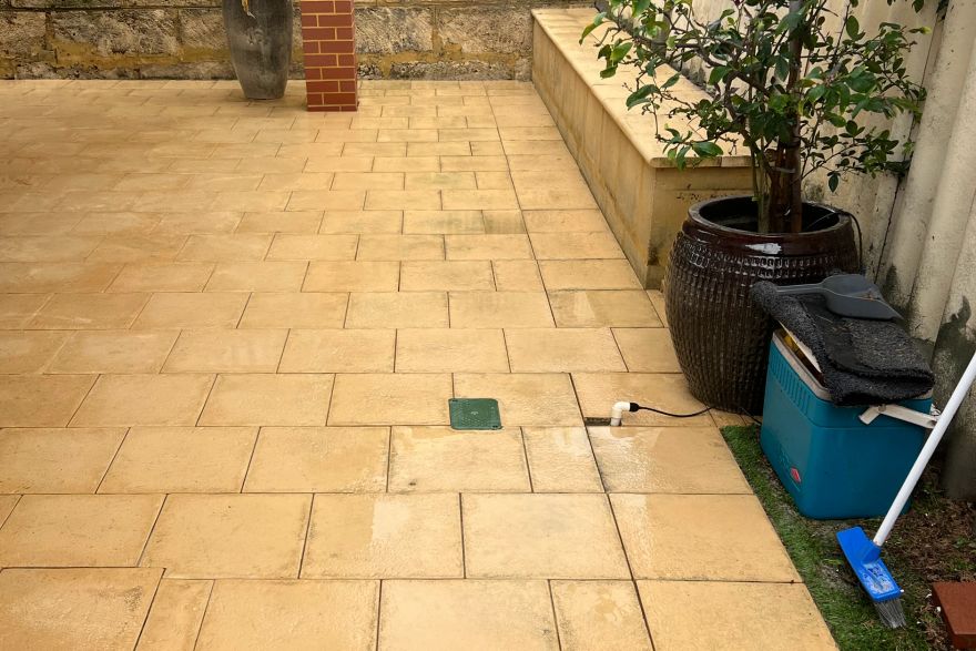 Before and after cleaning on sandstone pavers: after