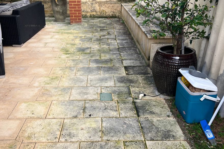 Before and after cleaning on sandstone pavers: before