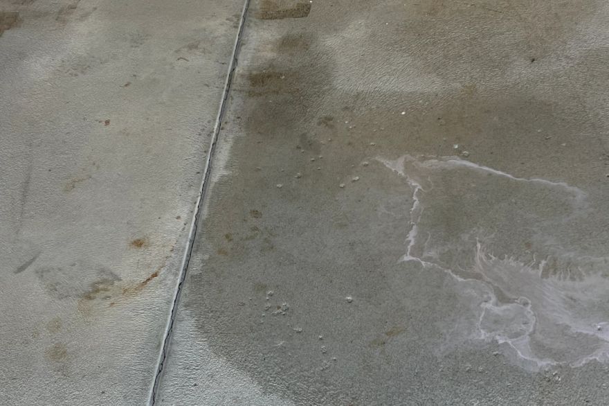 Before and after oil stains on concrete slab · Garage floor: after