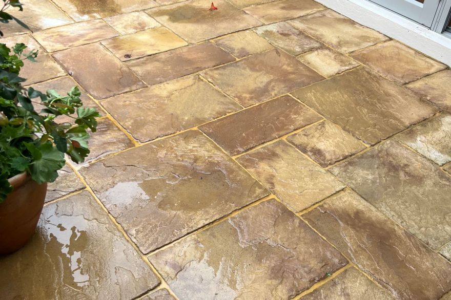 Before and after cleaning on natural stone · Patio / alfresco: after