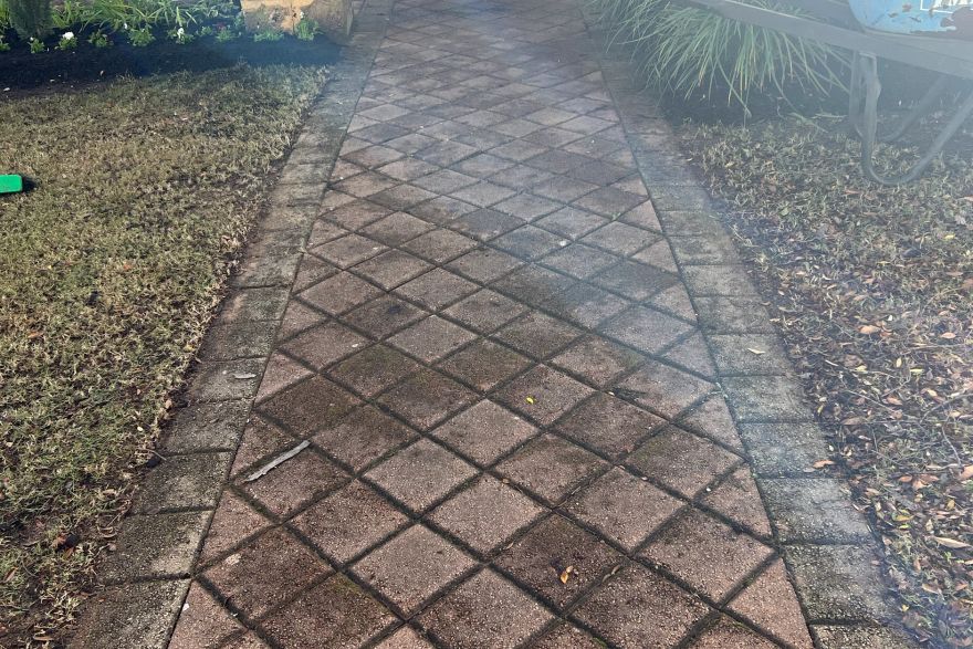 Before and after cleaning on brick pavers: before