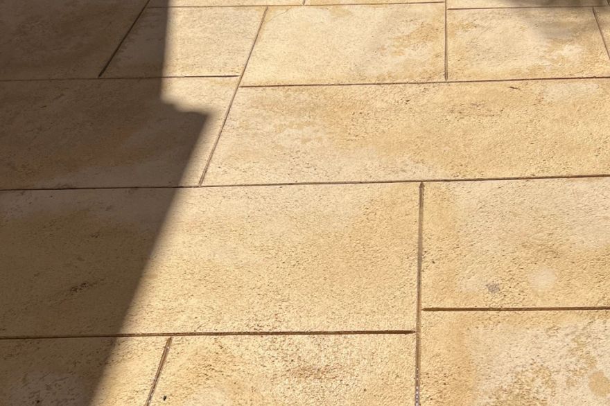 Before and after cleaning on liquid limestone · Patio / alfresco: after