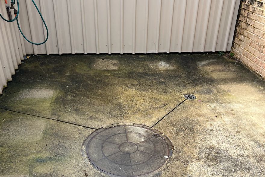 Before and after cleaning on concrete slab: before