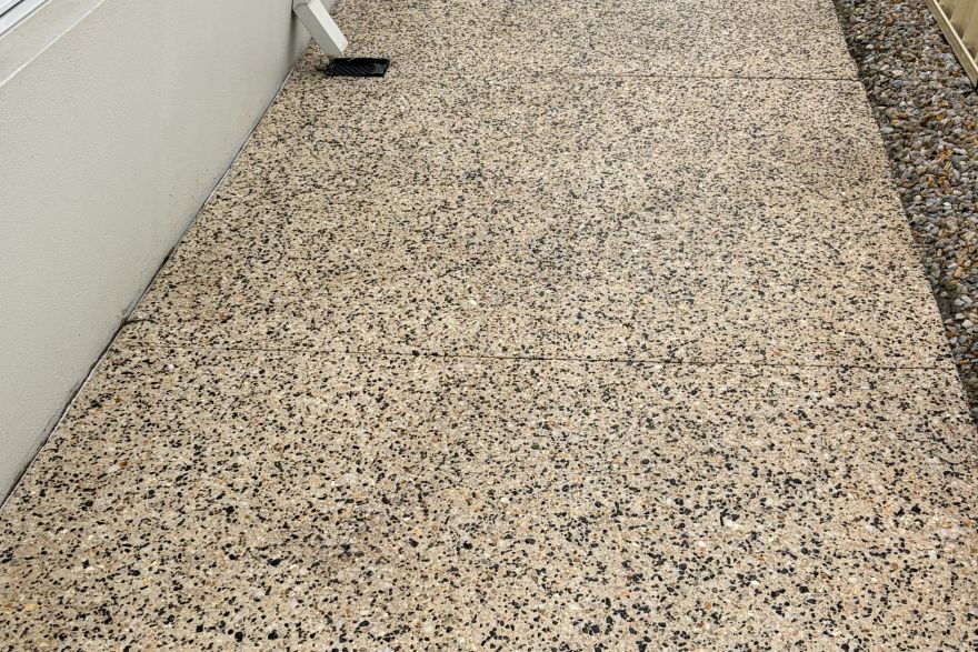 Before and after cleaning on concrete exposed aggregate: after