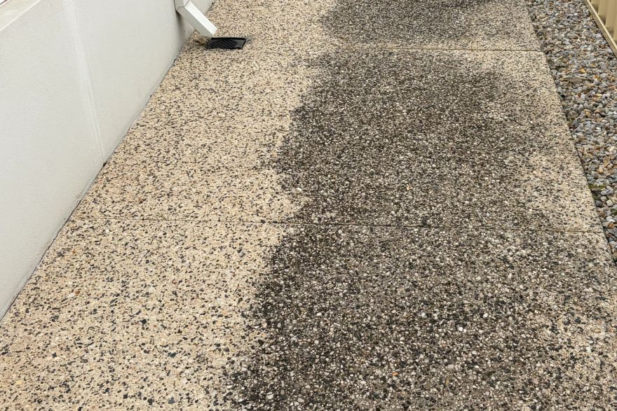 Before and after cleaning on concrete exposed aggregate: before