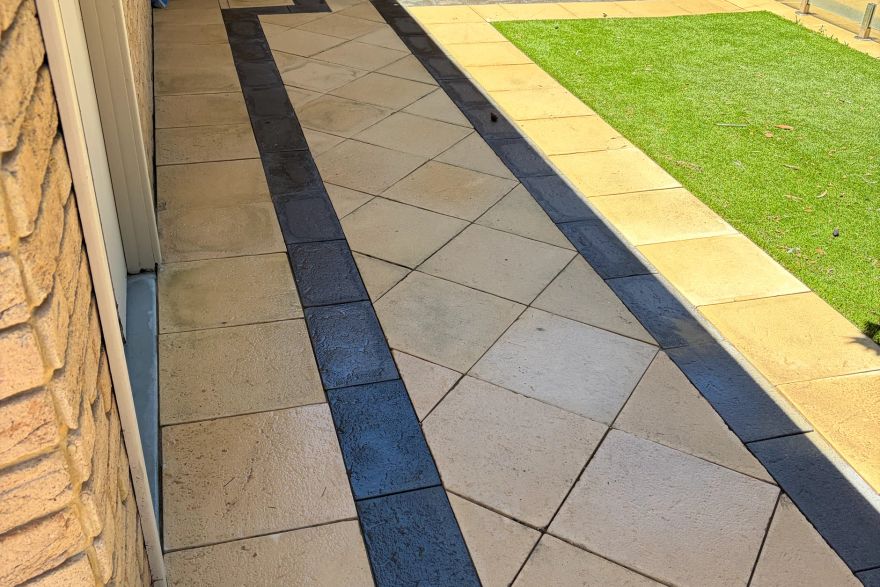 Before and after cleaning on sandstone pavers · Path: after