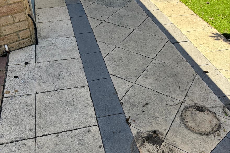 Before and after cleaning on sandstone pavers · Path: before