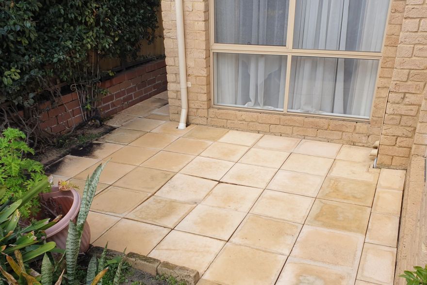 Before and after cleaning on sandstone pavers: after