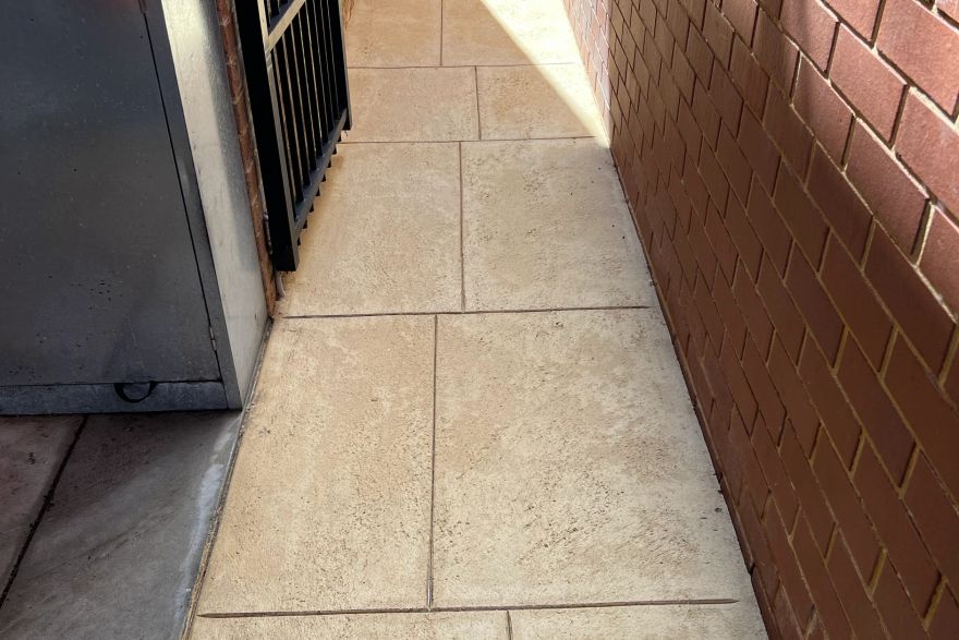 Before and after cleaning on liquid limestone · Side of house: after