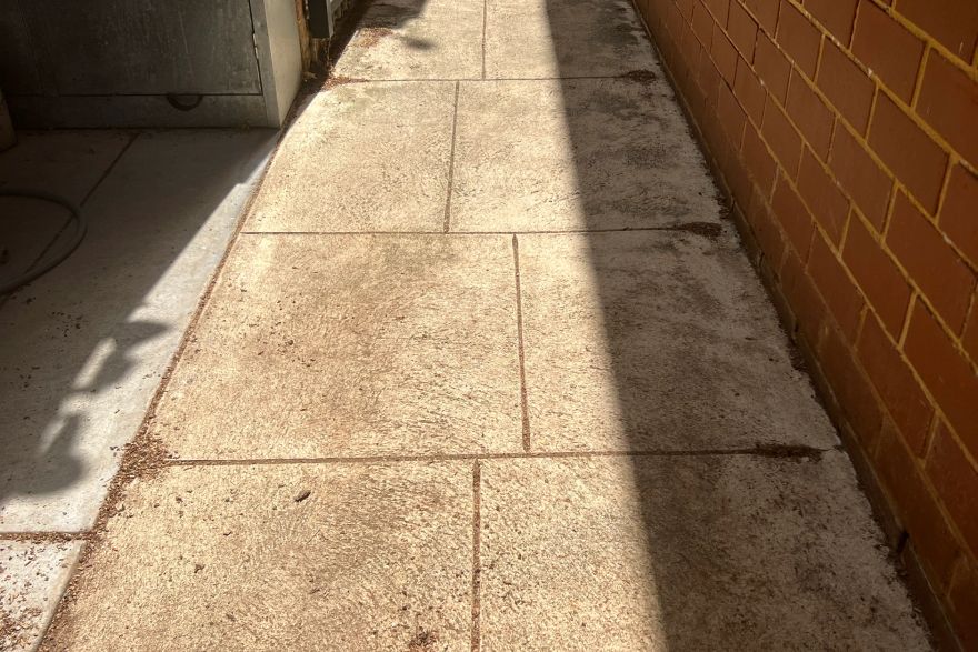 Before and after cleaning on liquid limestone · Side of house: before