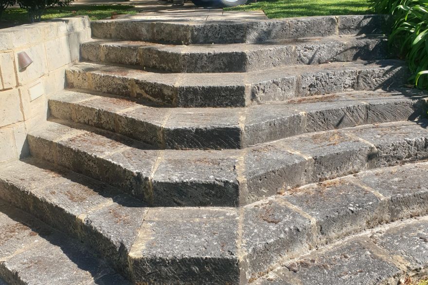Before and after cleaning on limestone block: before