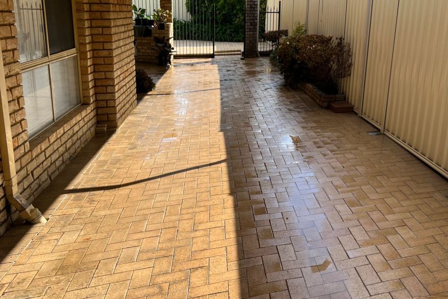 Before and after cleaning on brick pavers · Patio / alfresco: after