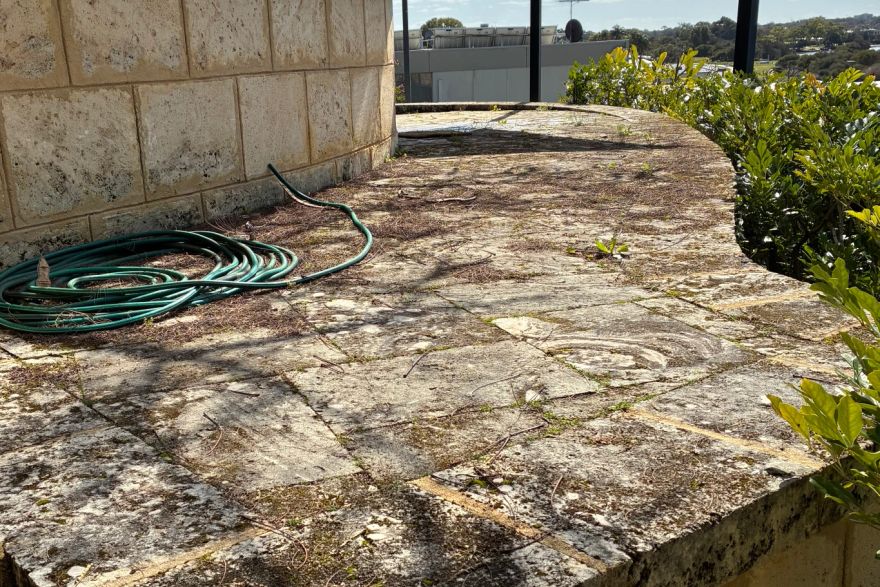 Before and after cleaning on limestone block: before