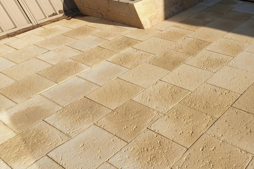 Before and after cleaning on sandstone pavers: after