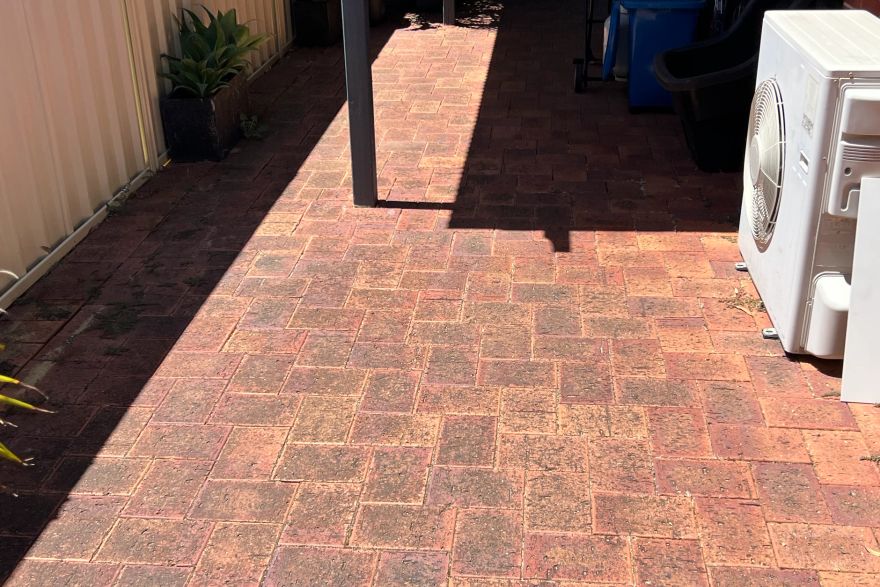Before and after cleaning on brick pavers: before
