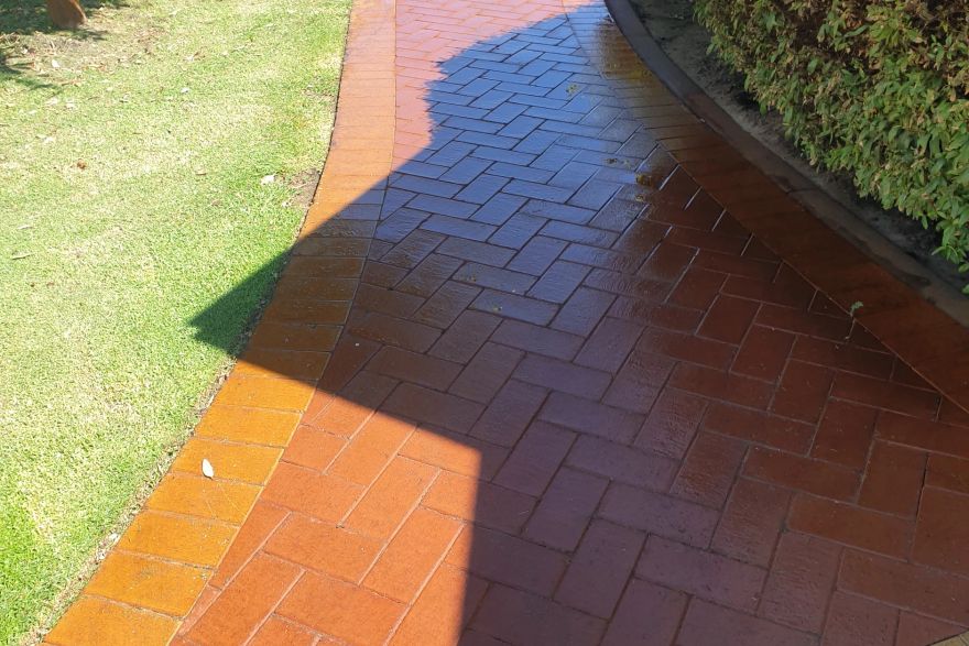 Before and after rust / bore stains on brick pavers: before