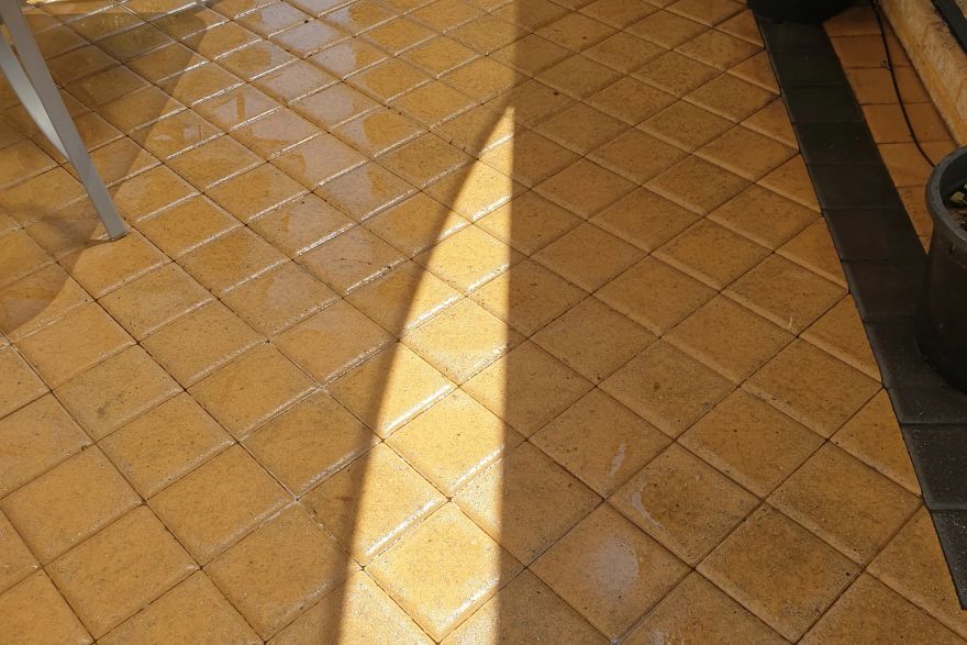 Before and after cleaning on brick pavers: after