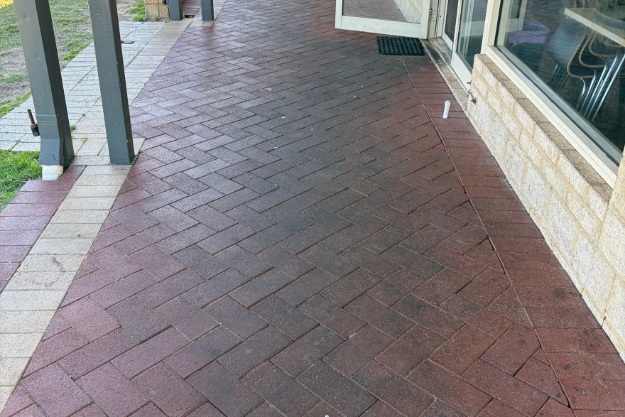 Before and after cleaning on brick pavers: before