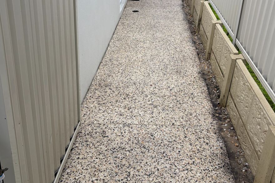 Before and after cleaning on concrete exposed aggregate: after