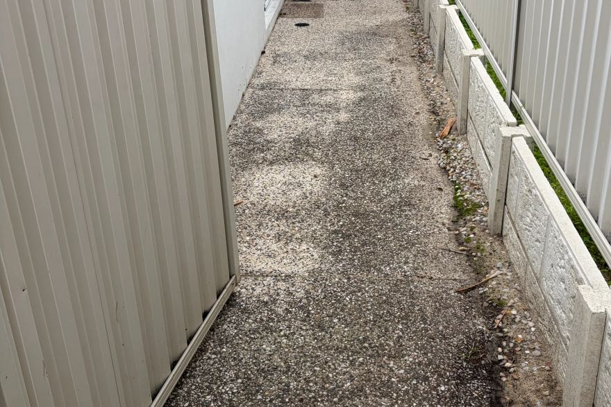 Before and after cleaning on concrete exposed aggregate: before