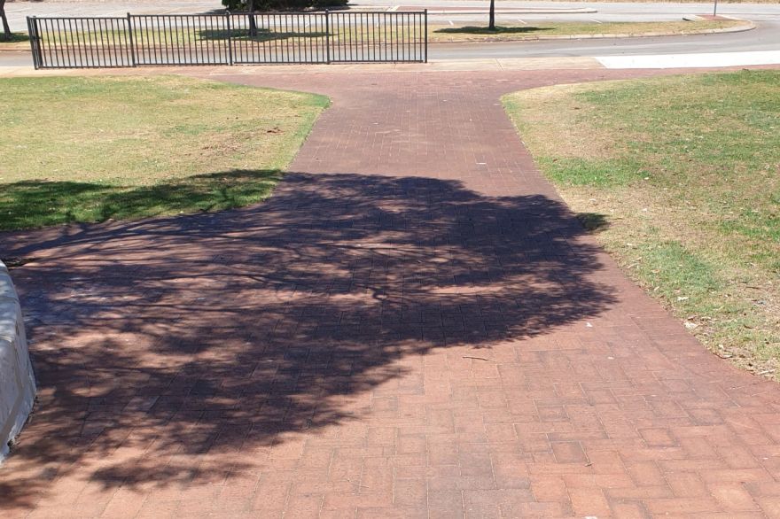Before and after cleaning on brick pavers: before