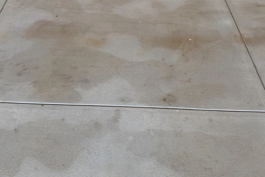 Before and after oil stains on concrete slab · Garage floor: after