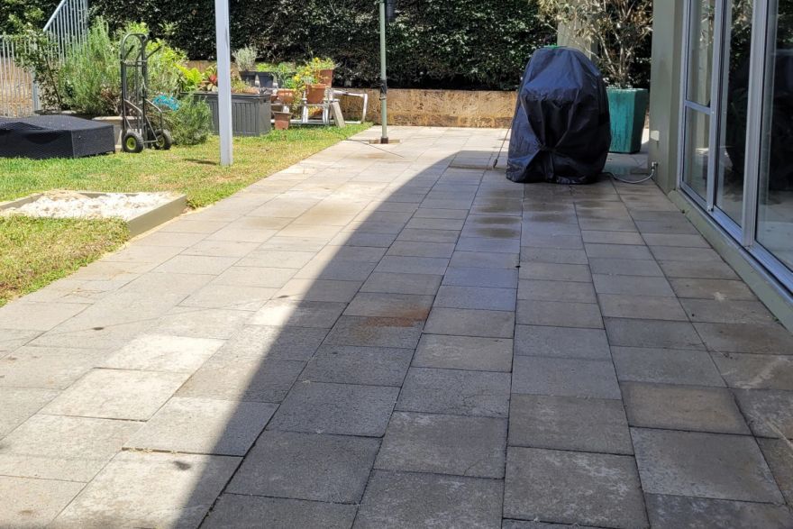 Before and after cleaning on concrete slab · Patio / alfresco: after