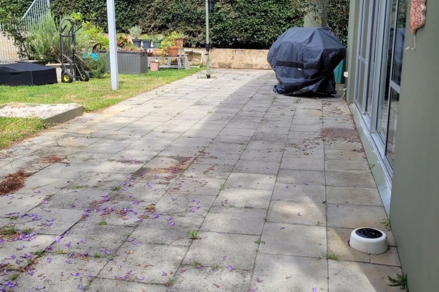 Before and after cleaning on concrete slab · Patio / alfresco: before