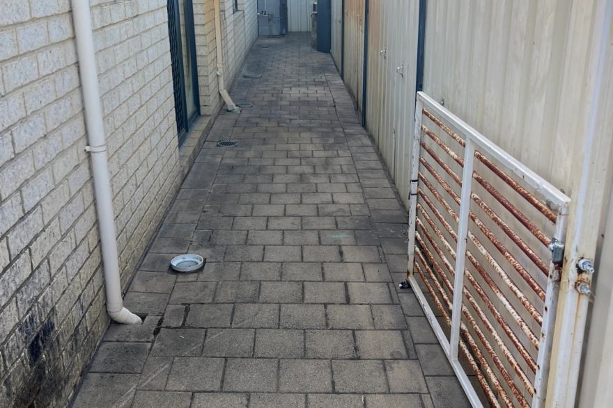 Before and after cleaning on brick pavers: before
