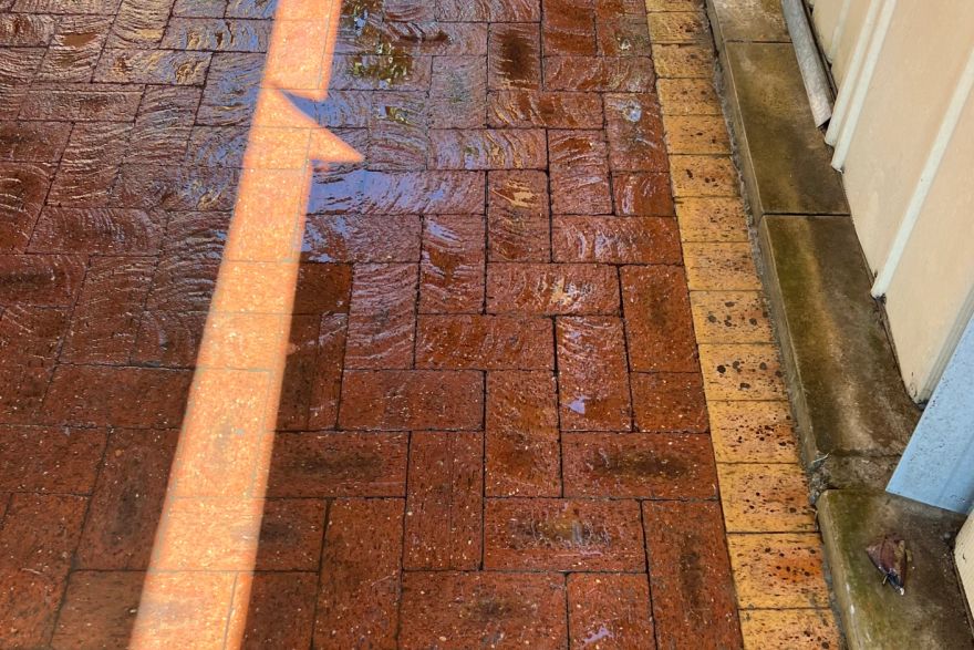 Before and after paint removal on brick pavers: after