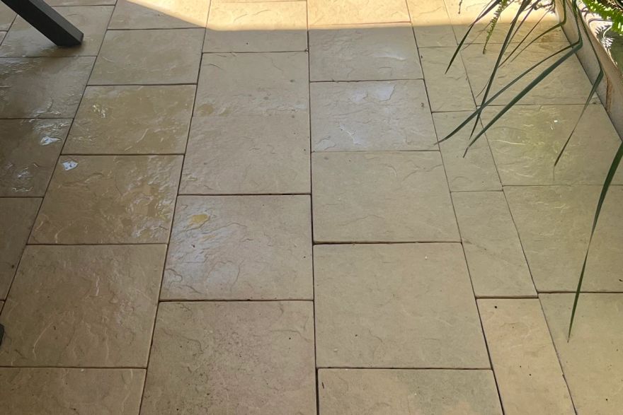 Before and after cleaning on sandstone pavers: after